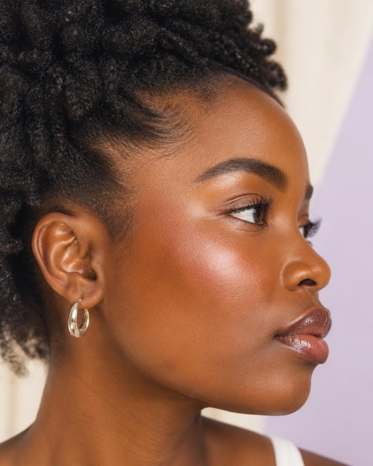 Woman with natural coily hair in profile